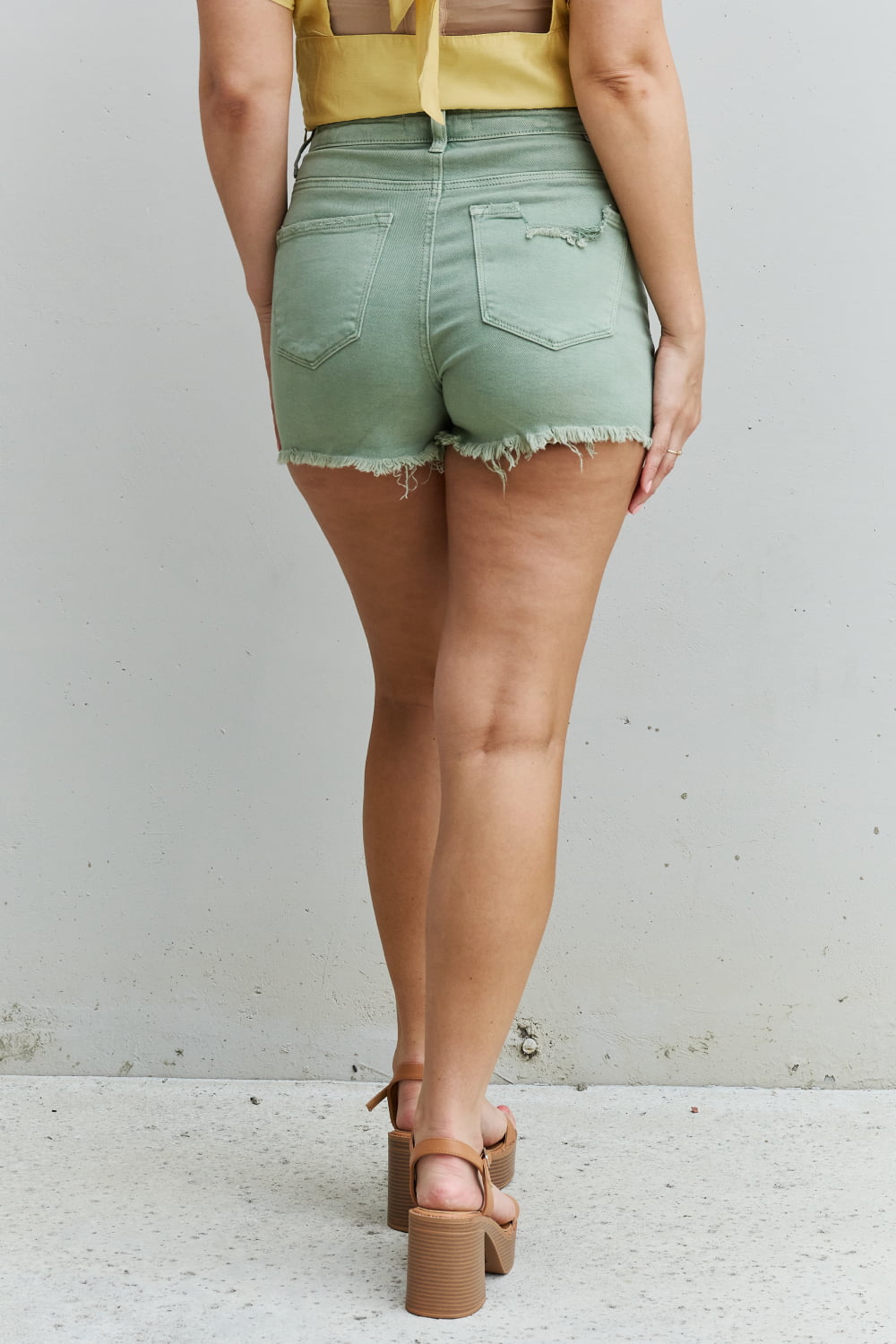 RISEN Katie Full Size High Waisted Distressed Shorts in Gum Leaf  - Doll Fits