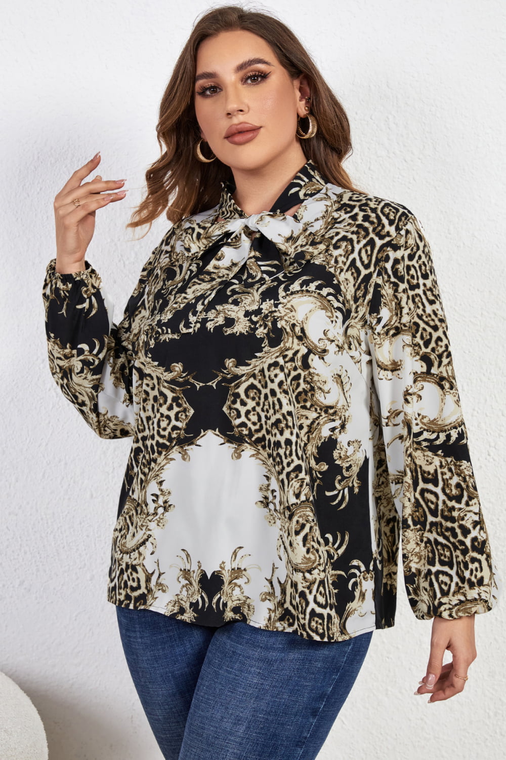 Melo Apparel Plus Size Printed Tie Neck Long Sleeve Blouse  - Doll Fits